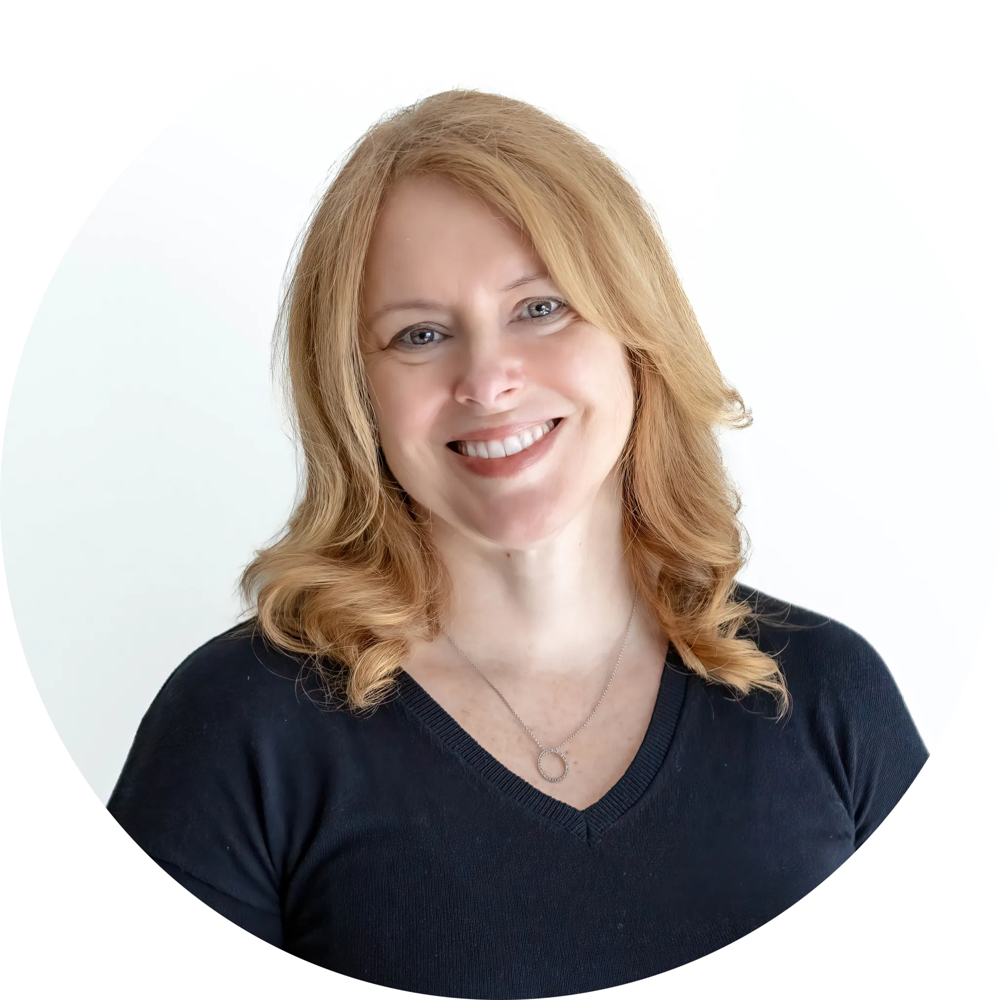 Woman smiling with curly hair, white background.