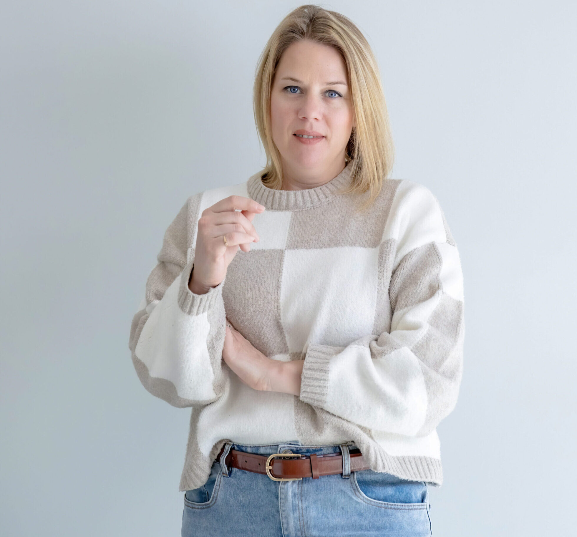 A woman holding a business card in her hand.
